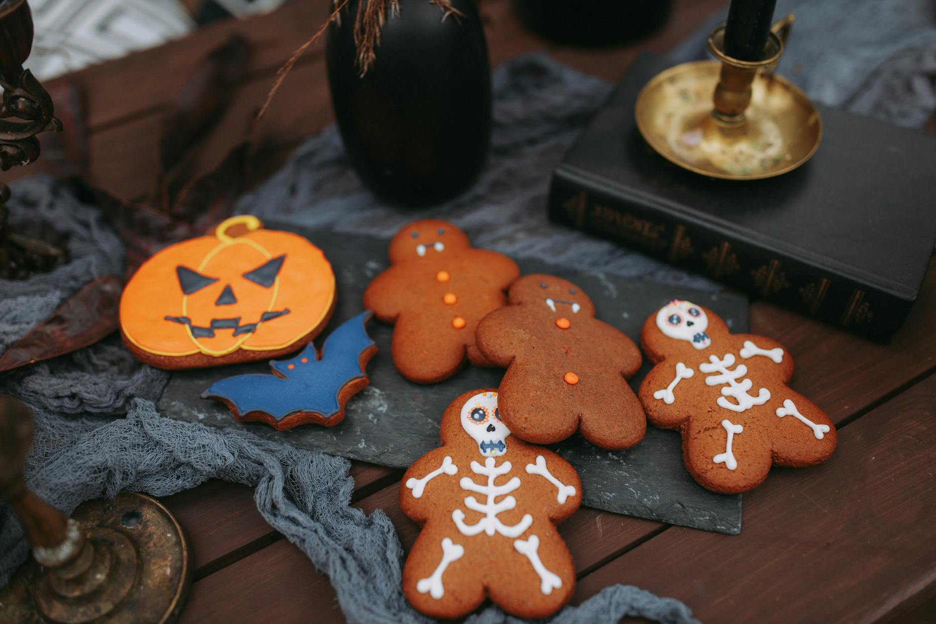 Festive fall scene with gingerbread cookies and pumpkins, showcasing Lily’s Chocolates & Café’s seasonal treats and holiday desserts.